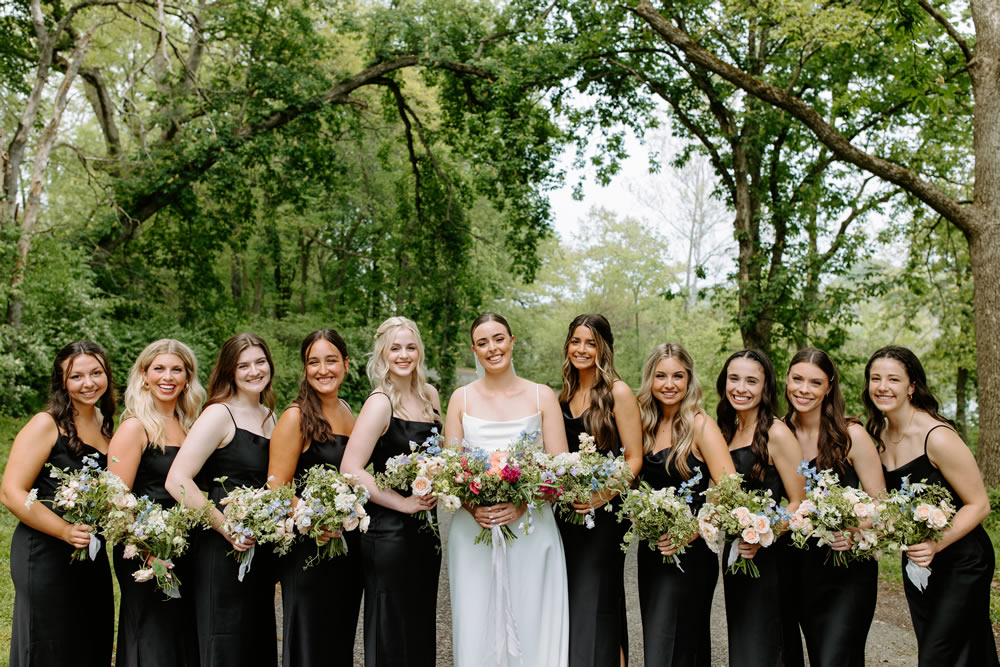 Bridesmaids holding florals. Photo by Olivia Doerfler Photography. 