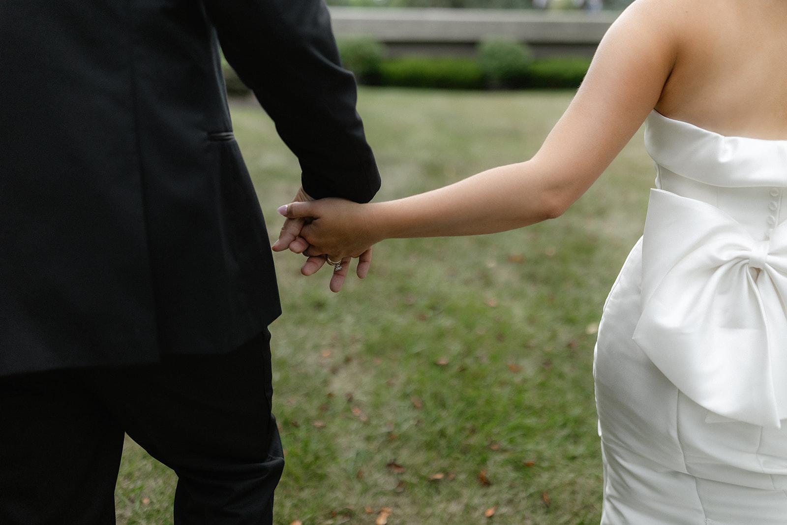 Mr. + Mrs. Girman Candid shot of newlyweds holding hands